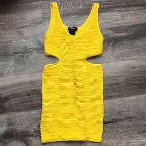Yellow bodycon dress with cutouts from Bebe
